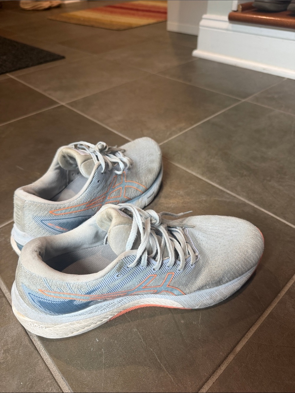 Light blue ASICS running shoes